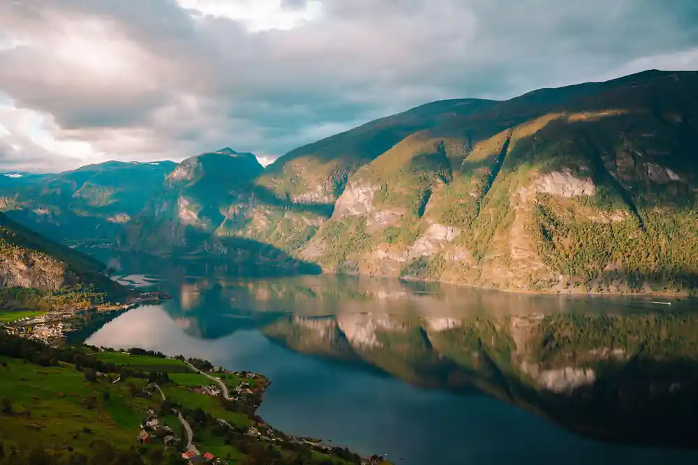 The fjord curving away below green and brown mountainsides