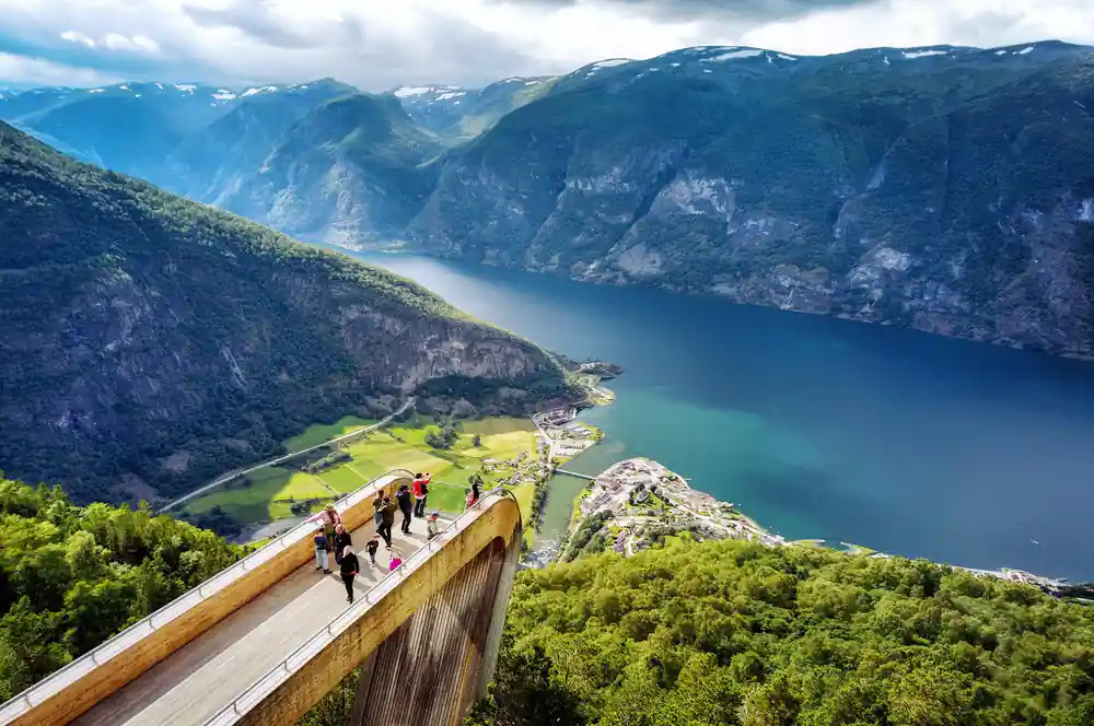 The Stegastein platform running out over the fjord with people walking along it
